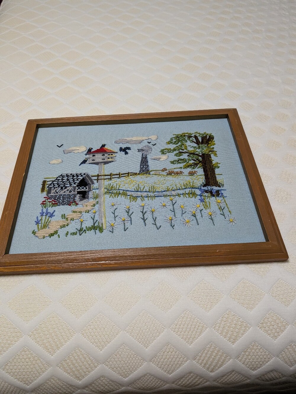 1970s Framed crewel embroidery Picture depicting farmhouse countryside scene-